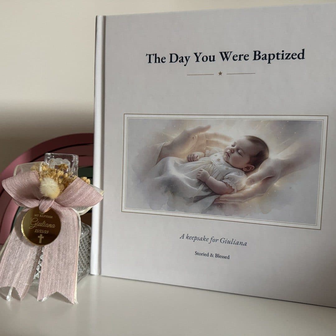 A real printed copy of the baptism keepsake book, photographed at home